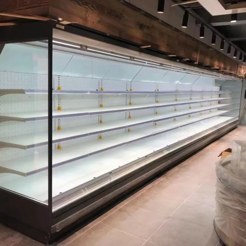 Empty refrigerated shelves in a supermarket after a cyberattack disrupted cooling systems